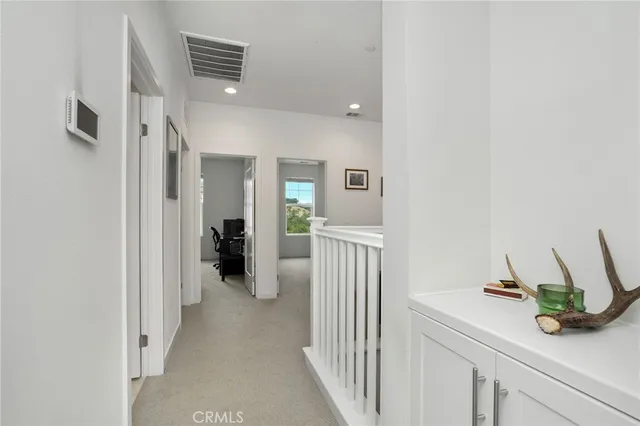a bedroom with a bed and flat screen tv