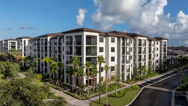 a view of building with balcony and seating space