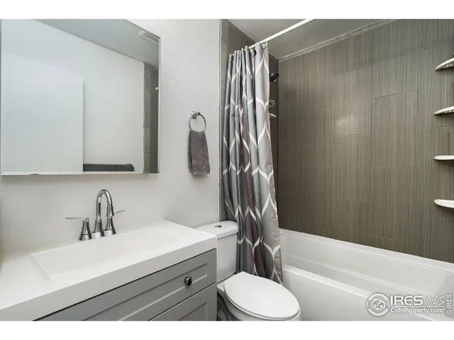a bathroom with a sink a toilet and bathtub