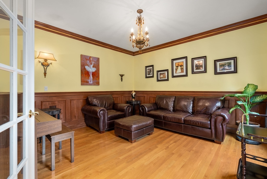15 Beaver Brook Road Canton, MA 02021 - Photo 13 of 33 a living room with furniture and a chandelier