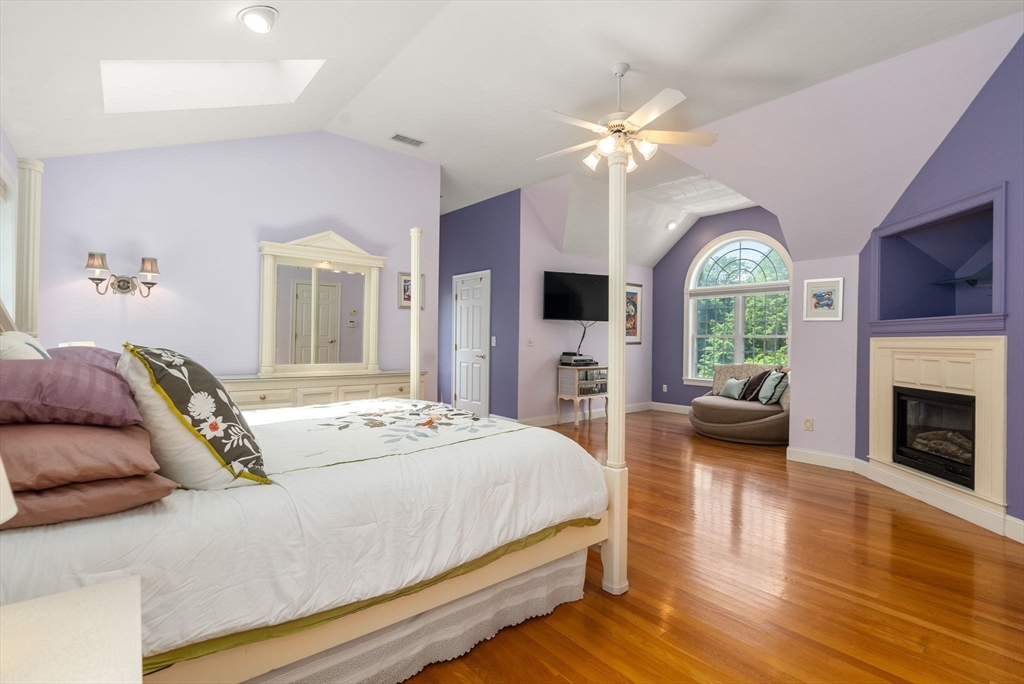 15 Beaver Brook Road Canton, MA 02021 - Photo 18 of 33 a bedroom with a large bed and a fireplace