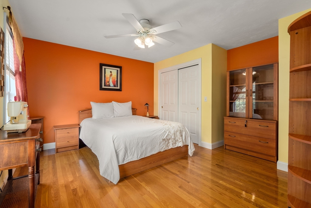 15 Beaver Brook Road Canton, MA 02021 - Photo 23 of 33 a spacious bedroom with a bed and a chandelier