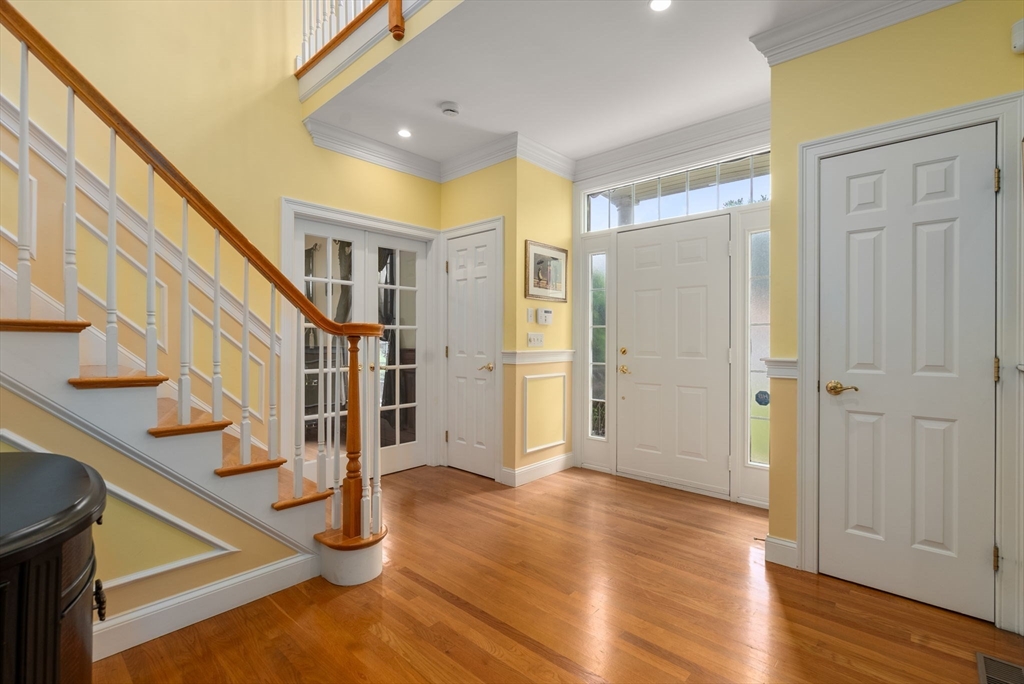 15 Beaver Brook Road Canton, MA 02021 - Photo 3 of 33 a view of an entryway with wooden floor and staircase