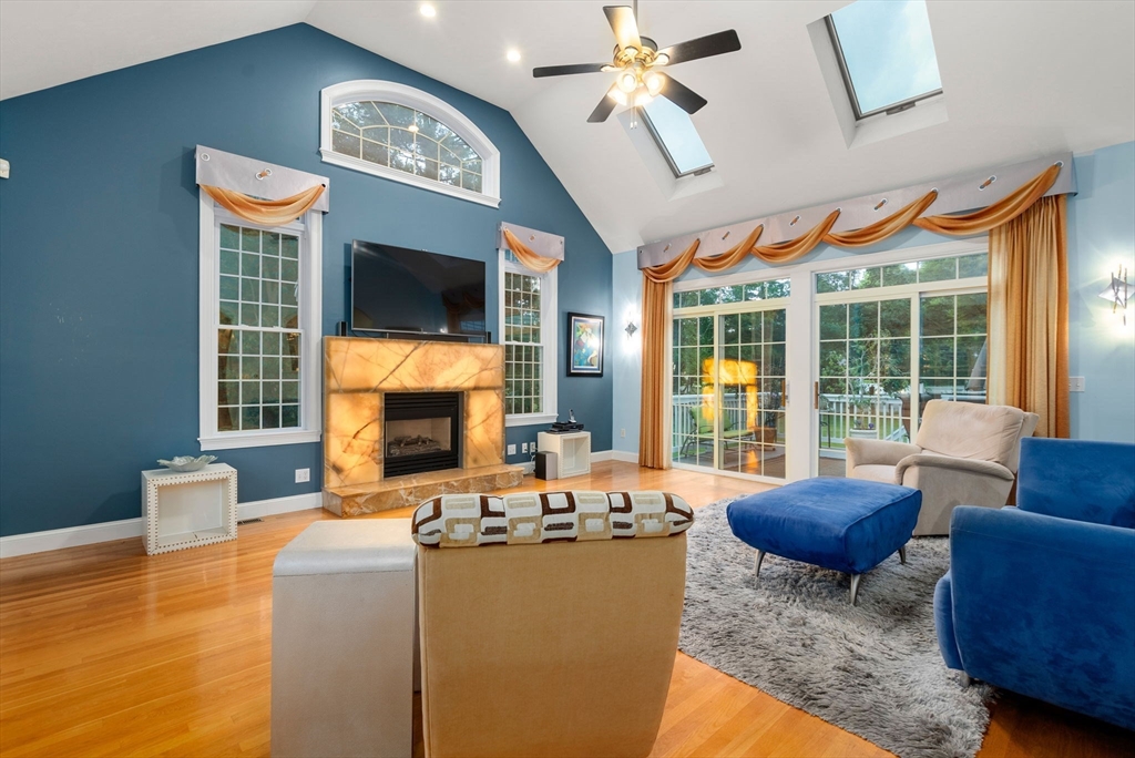 15 Beaver Brook Road Canton, MA 02021 - Photo 10 of 33 a living room with fireplace furniture and a large window