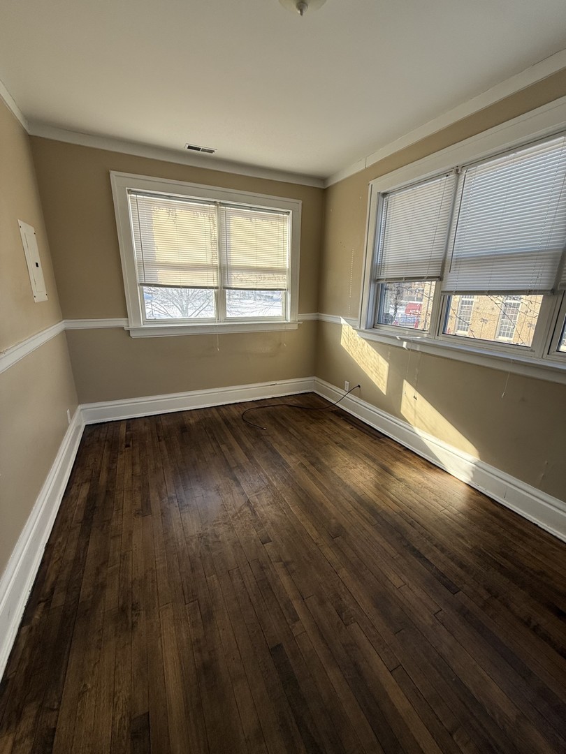 314 West Main Street, Unit 3R St. Charles, IL 60174 - Photo 11 of 11 wooden floor in an empty room with a window