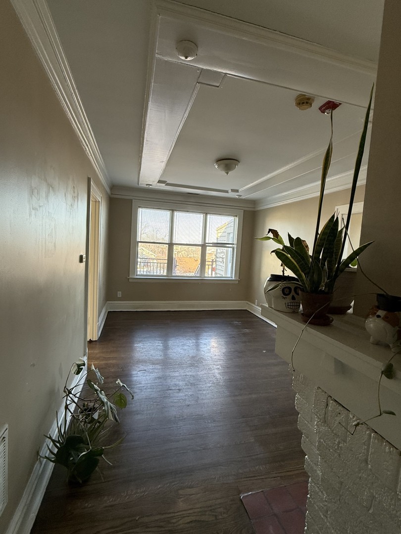 314 West Main Street, Unit 3R St. Charles, IL 60174 - Photo 4 of 11 wooden floor in an empty room with a window