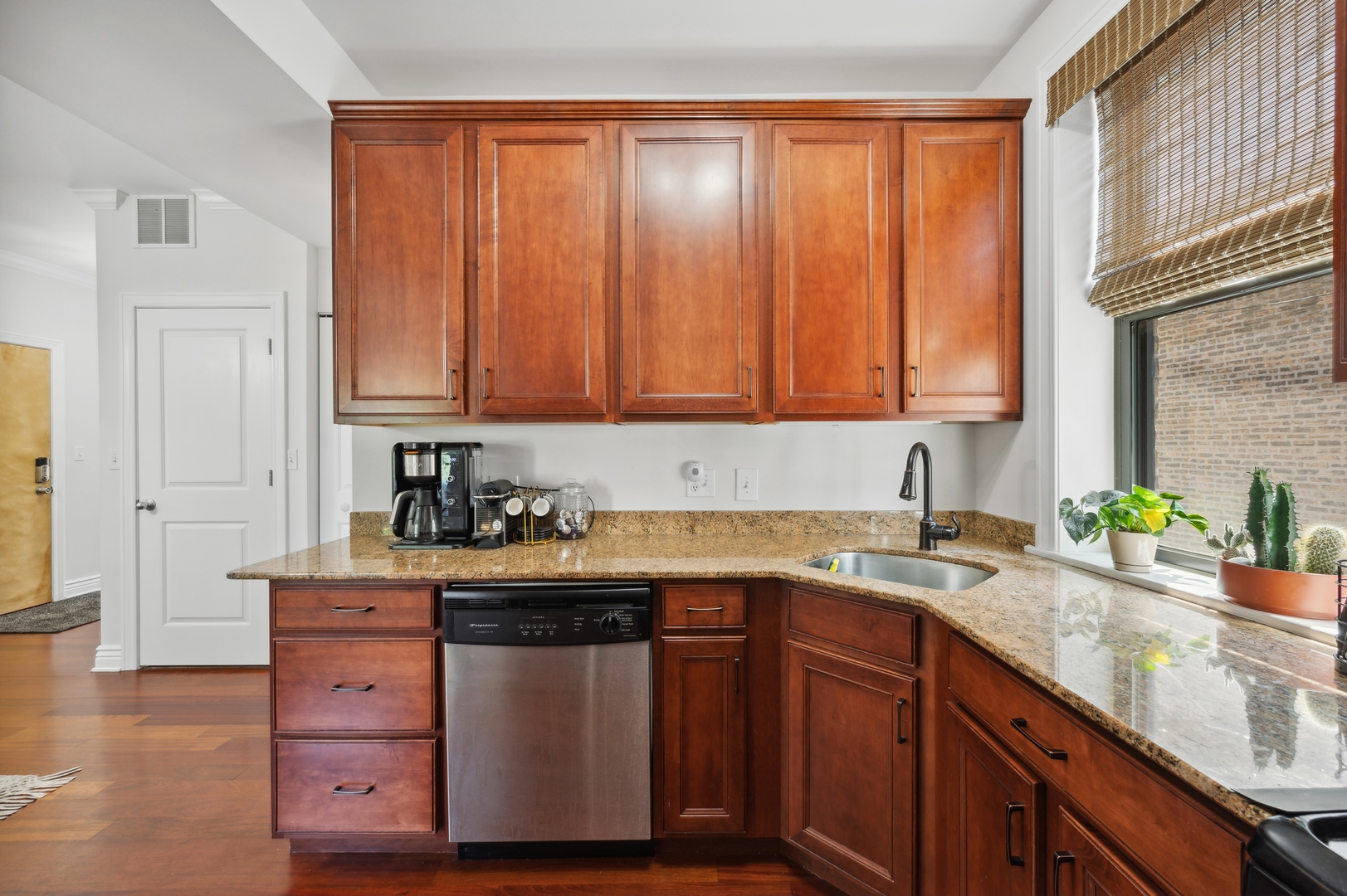 1610 West Byron Street, Unit 2 Chicago, IL 60613 - Photo 11 of 21 a kitchen with stainless steel appliances granite countertop a sink a stove and cabinets