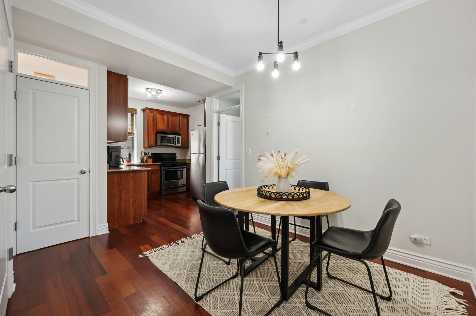 1610 West Byron Street, Unit 2 Chicago, IL 60613 - Photo 13 of 21 a view of a dining room with furniture and wooden floor