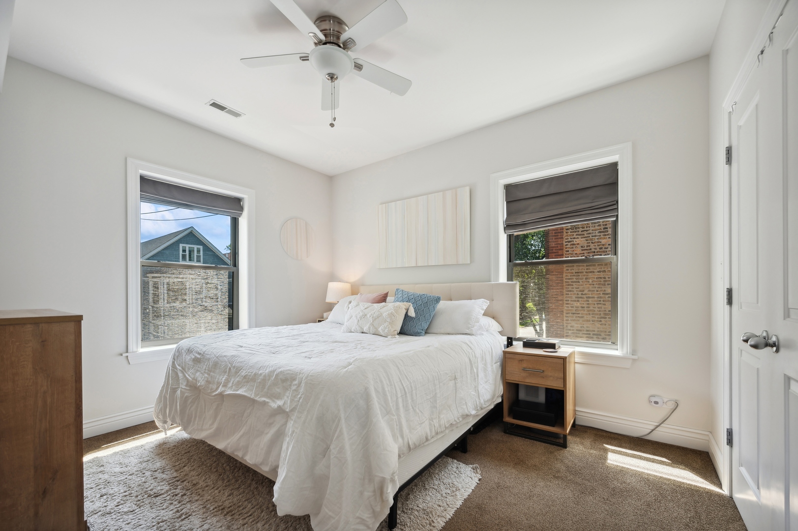 1610 West Byron Street, Unit 2 Chicago, IL 60613 - Photo 16 of 21 a bedroom with a bed and a window