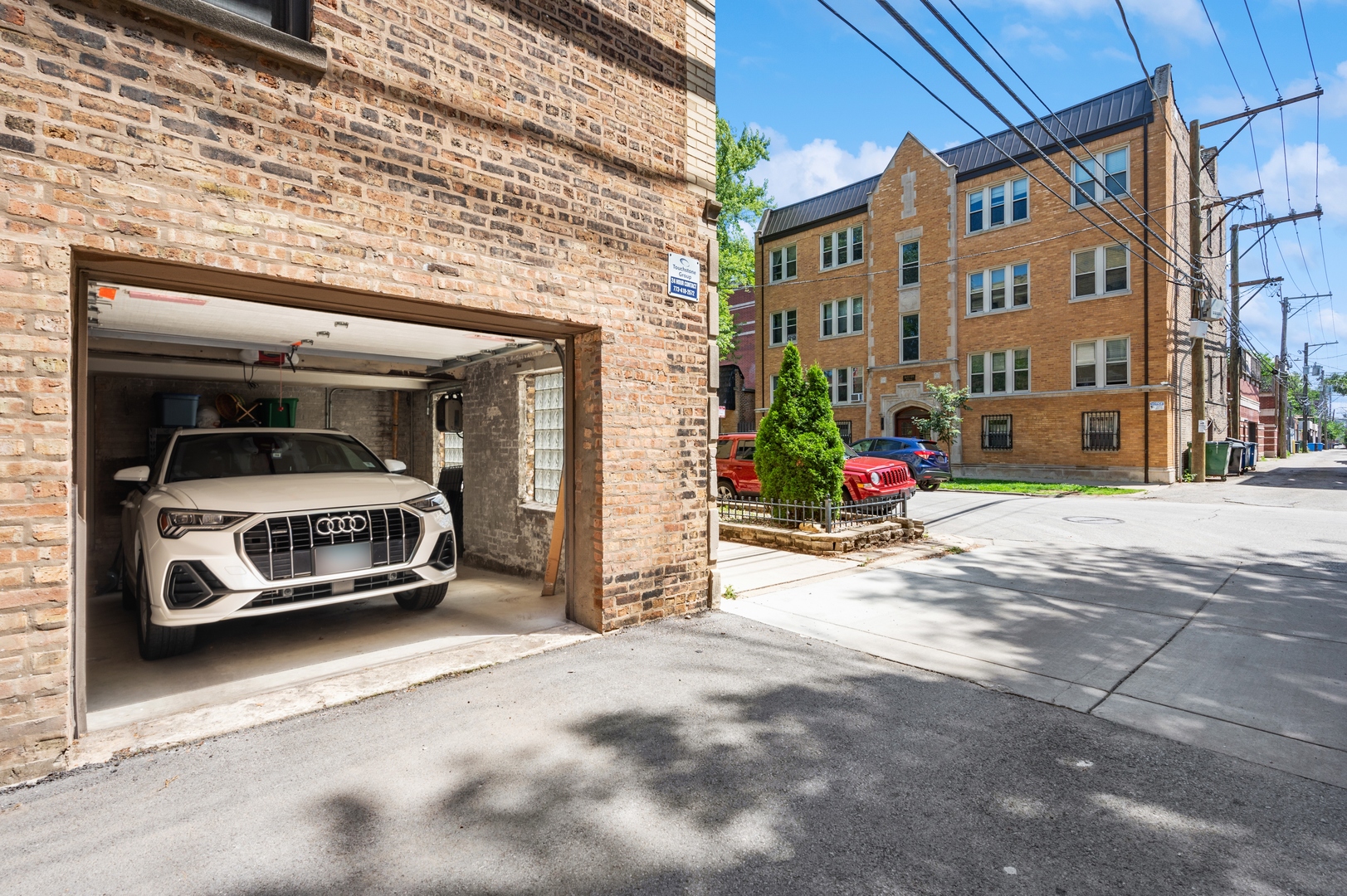 1610 West Byron Street, Unit 2 Chicago, IL 60613 - Photo 21 of 21 a view of car parked in front of brick building