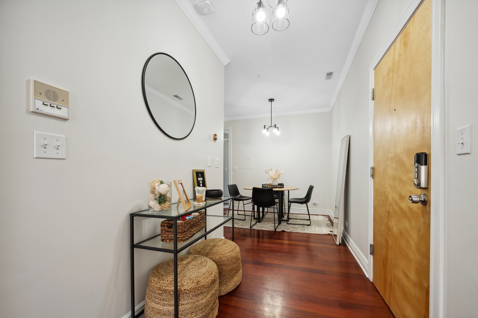 1610 West Byron Street, Unit 2 Chicago, IL 60613 - Photo 4 of 21 a very nice looking room with a dining table chairs and couches with wooden floor