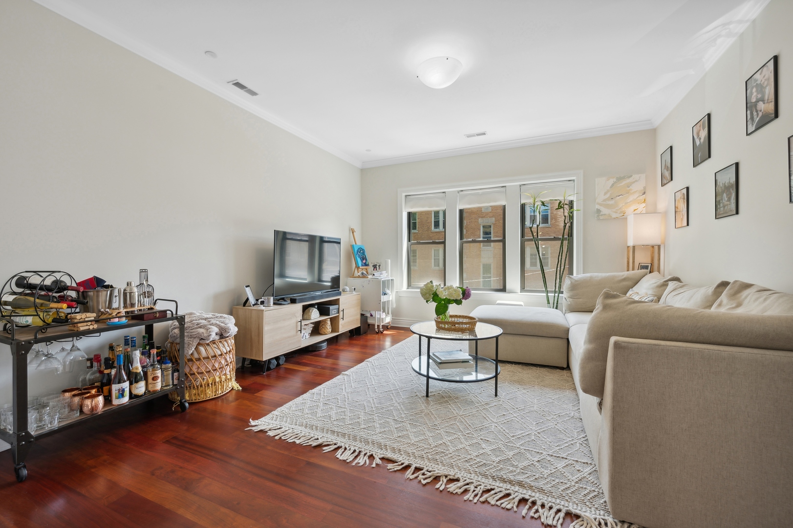 1610 West Byron Street, Unit 2 Chicago, IL 60613 - Photo 7 of 21 a living room with furniture and a flat screen tv