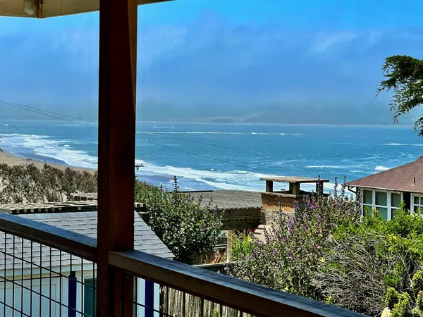 a view of a balcony with an ocean view