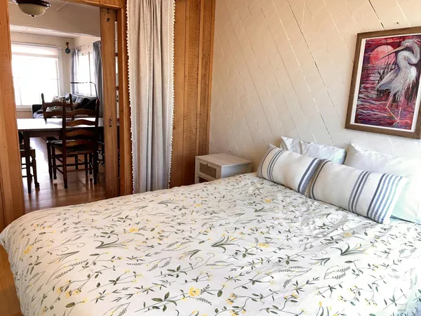 a bedroom with a bed and a cabinets
