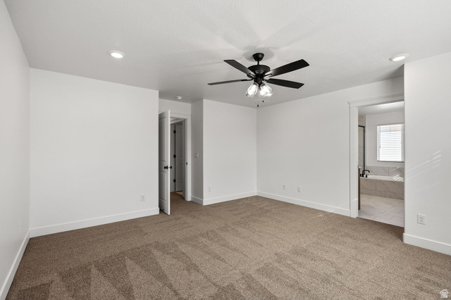 1661 West Ross Road Syracuse, UT 84075 - Photo 16 of 28 Unfurnished bedroom with carpet, ceiling fan, and connected bathroom