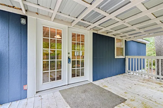 a view of a hall with wooden floor