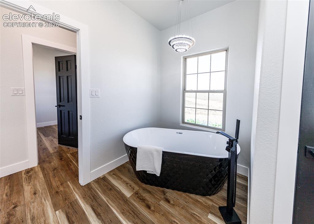 1120 Newton Road Pueblo, CO 81005 - Photo 16 of 46 a bedroom with a bed and a window