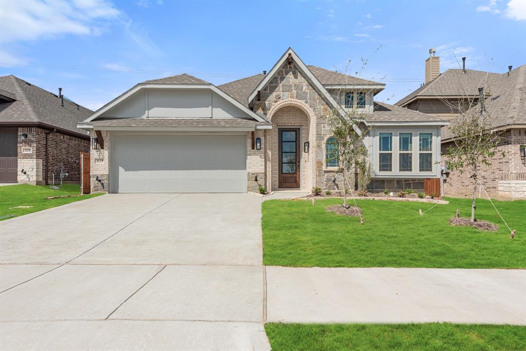 833 Godley Ranch Godley, TX 76044 - Photo 1 of 1 a front view of a house with a garden