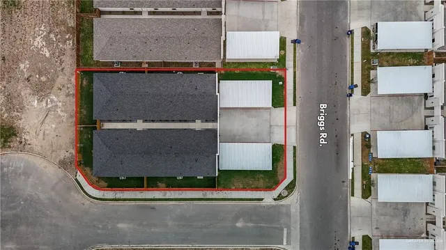 an aerial view of residential houses with outdoor space