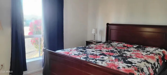 a bathroom with a sink and mirror with toilet