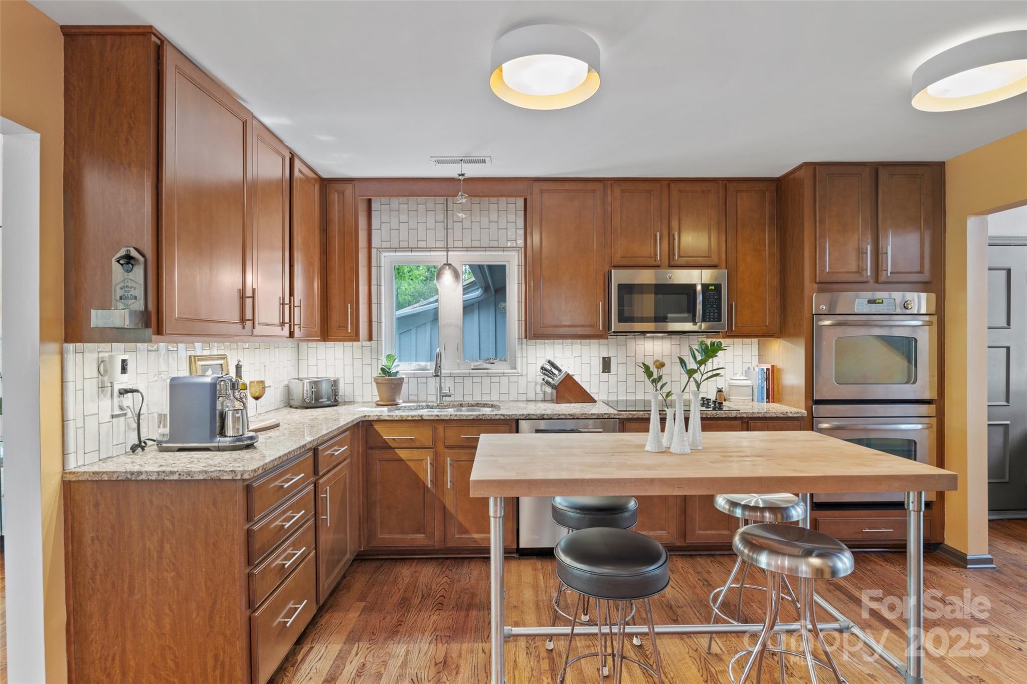 4609 Rounding Run Road Charlotte, NC 28277 - Photo 12 of 48 a kitchen with a sink stove and microwave