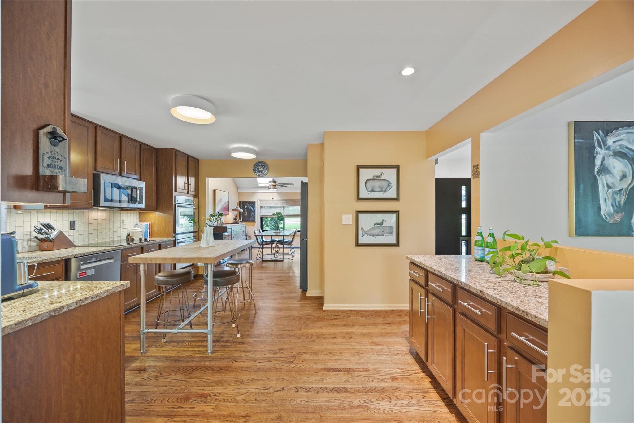 4609 Rounding Run Road Charlotte, NC 28277 - Photo 13 of 48 a kitchen with stainless steel appliances kitchen island granite countertop a sink and cabinets