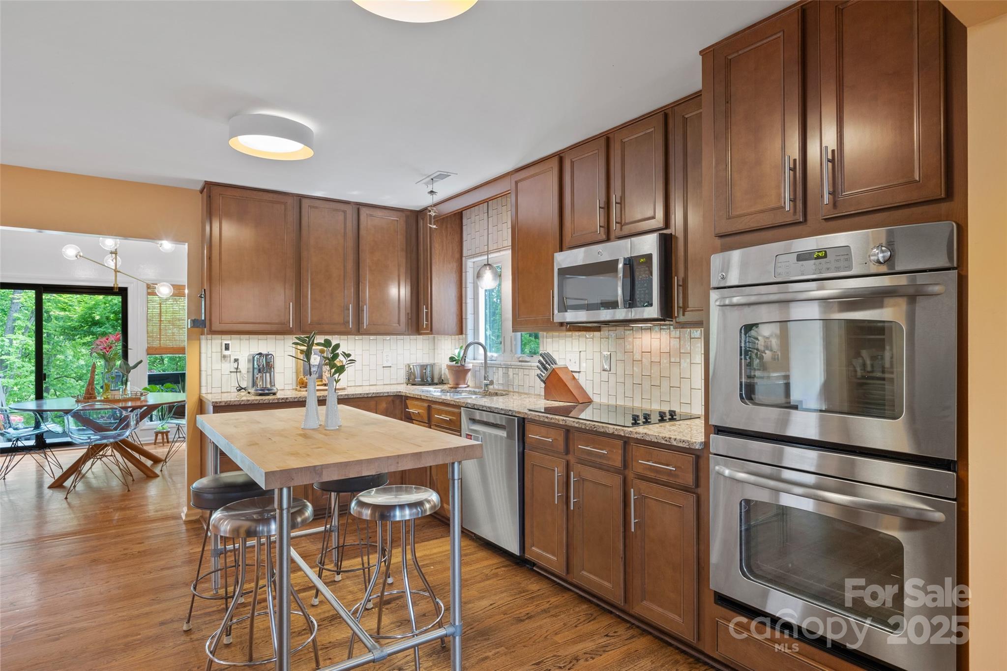 4609 Rounding Run Road Charlotte, NC 28277 - Photo 14 of 48 a kitchen with a sink stove and microwave