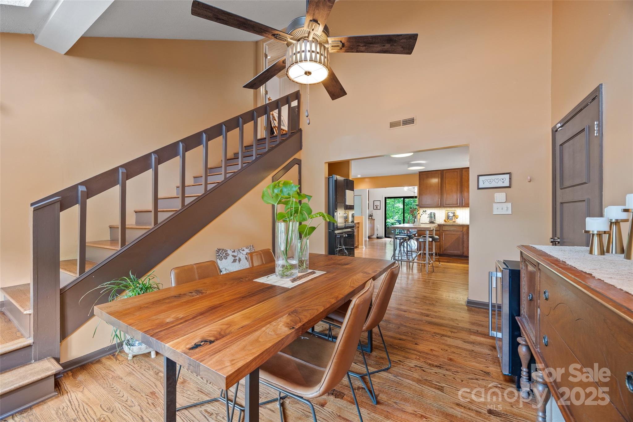4609 Rounding Run Road Charlotte, NC 28277 - Photo 16 of 48 a dining room with furniture a chandelier and wooden floor