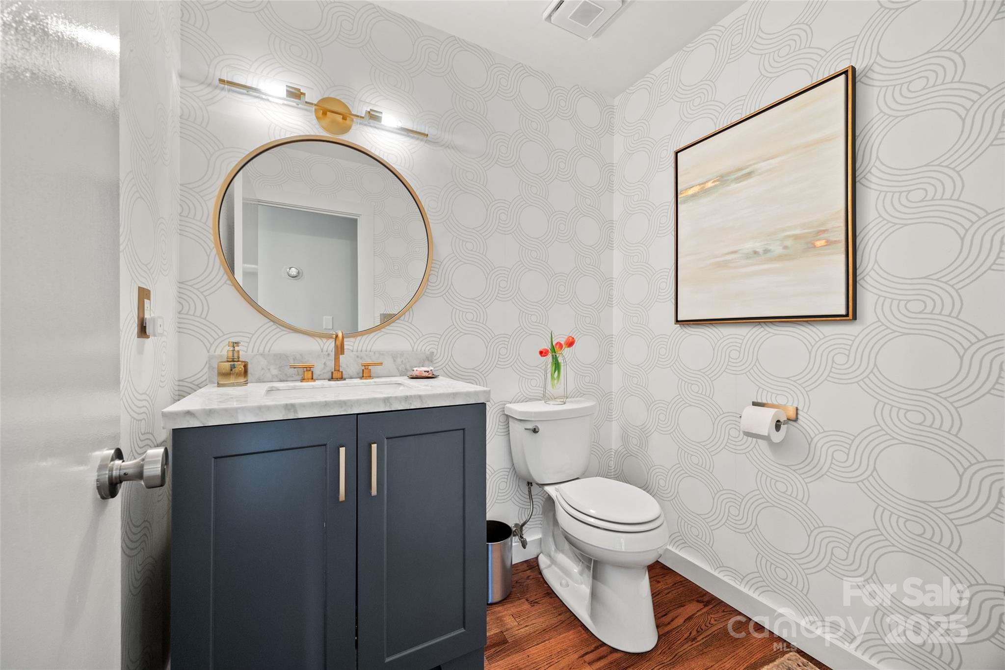4609 Rounding Run Road Charlotte, NC 28277 - Photo 19 of 48 a bathroom with a toilet a sink and a mirror