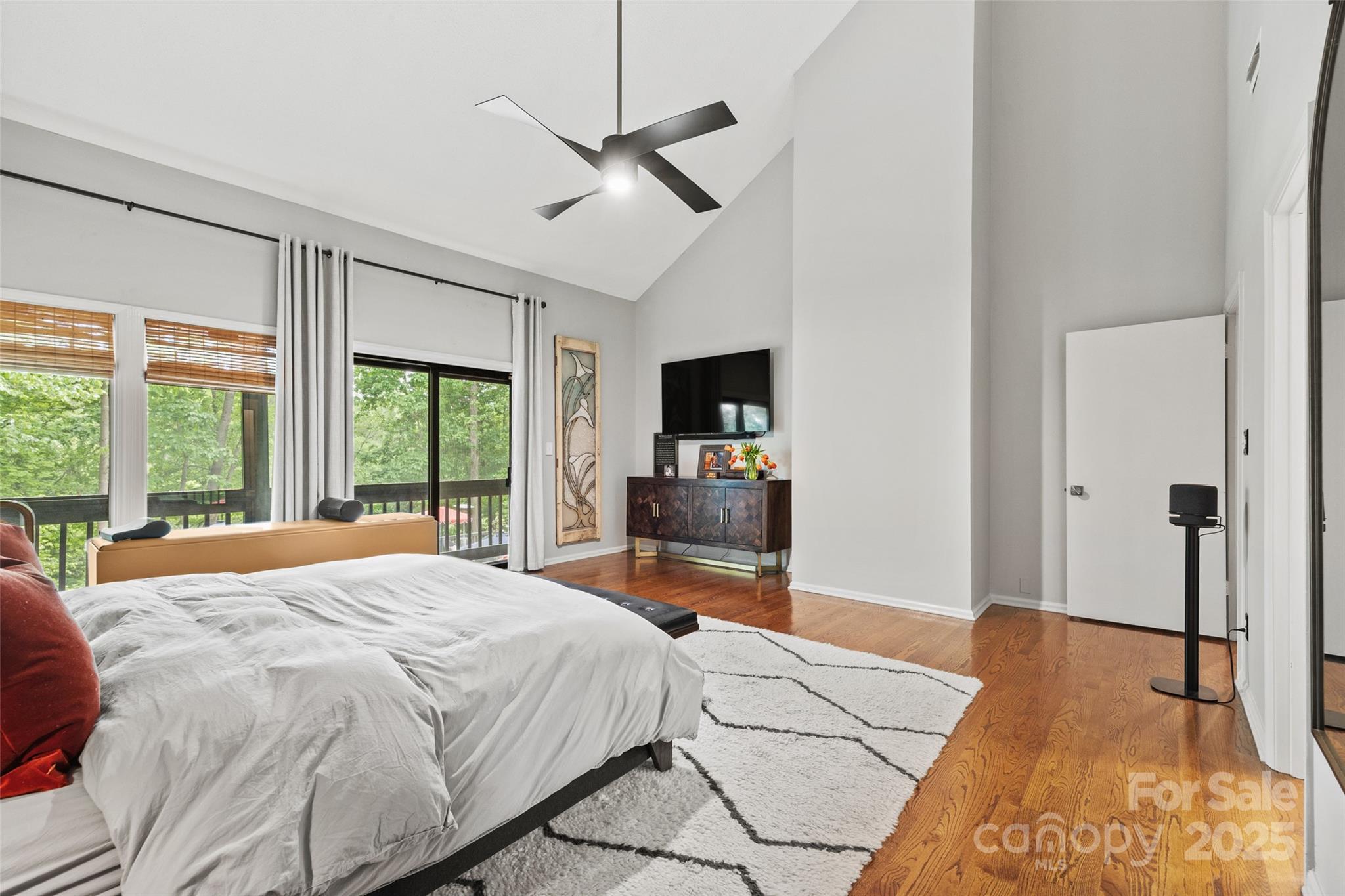 4609 Rounding Run Road Charlotte, NC 28277 - Photo 21 of 48 a bedroom with a large bed and a large window