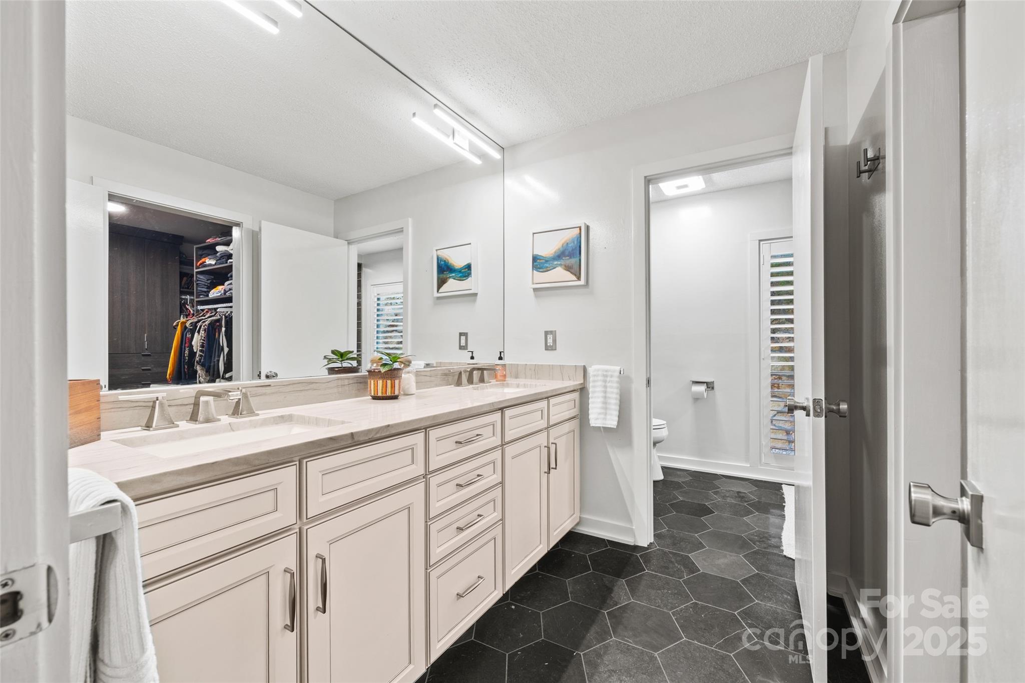 4609 Rounding Run Road Charlotte, NC 28277 - Photo 23 of 48 a spacious bathroom with a double vanity sink mirror and a