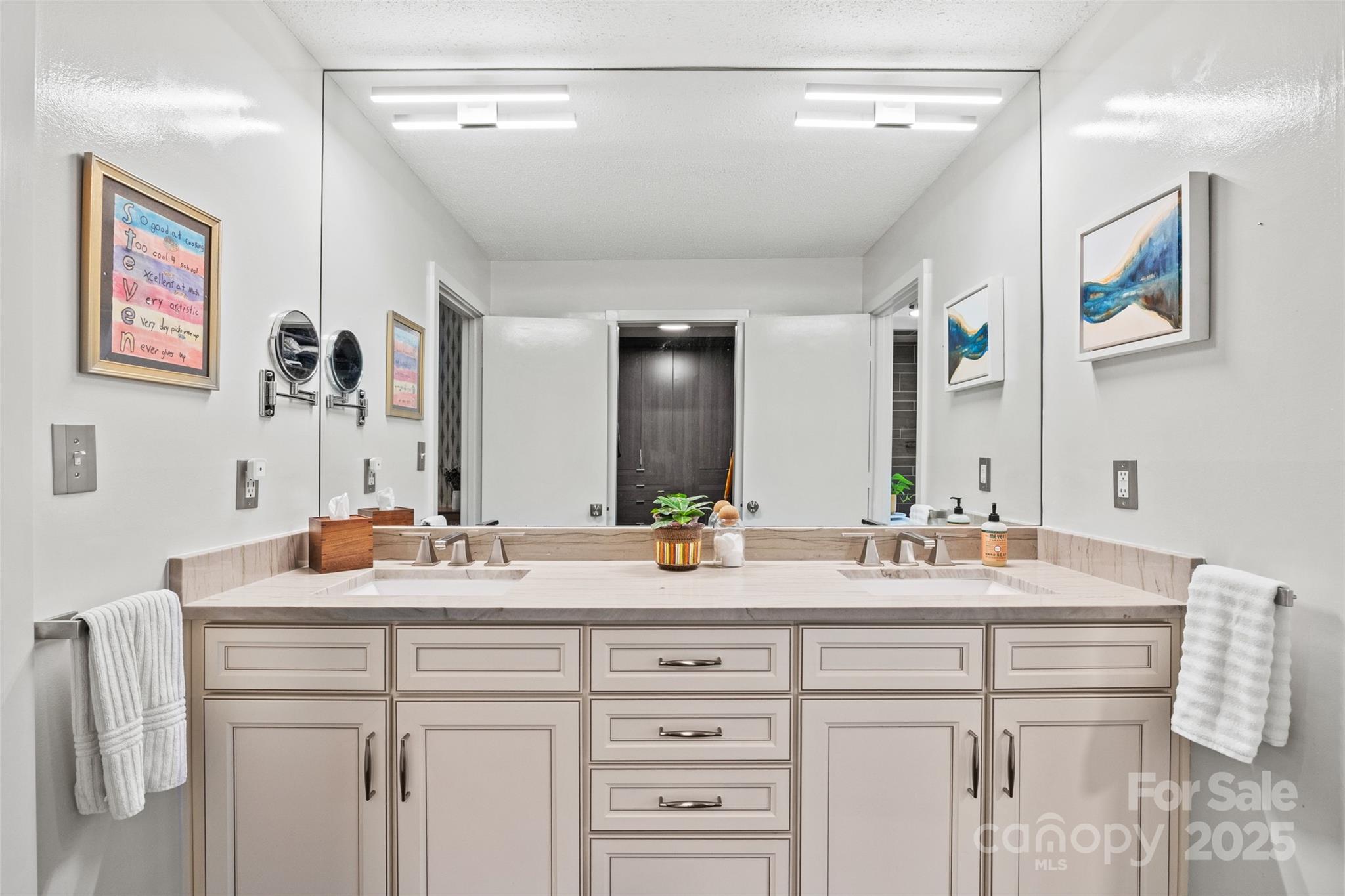 4609 Rounding Run Road Charlotte, NC 28277 - Photo 24 of 48 a bathroom with a double vanity sink and a mirror