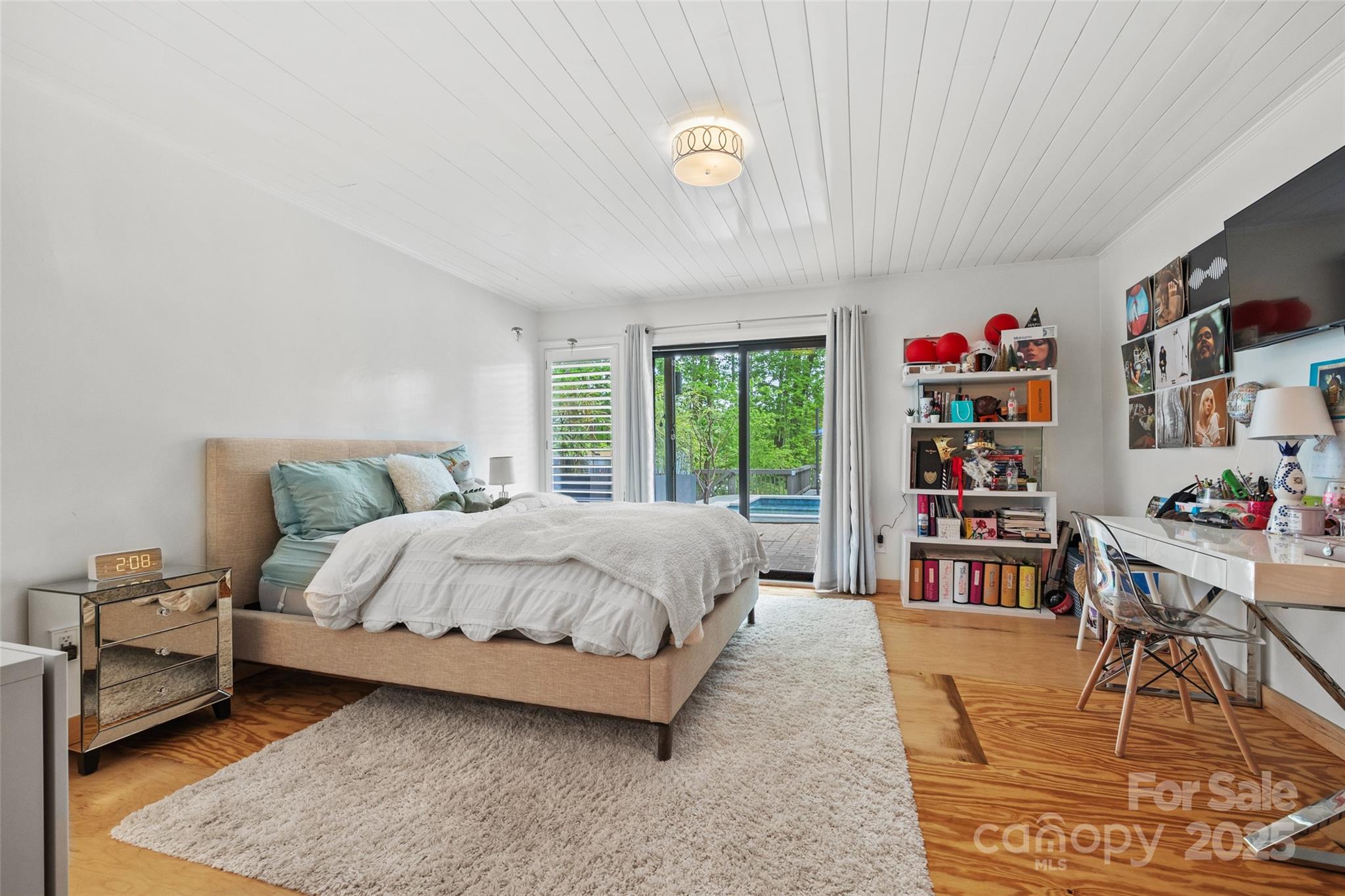 4609 Rounding Run Road Charlotte, NC 28277 - Photo 30 of 48 a bedroom with a bed a bookshelf and a large window