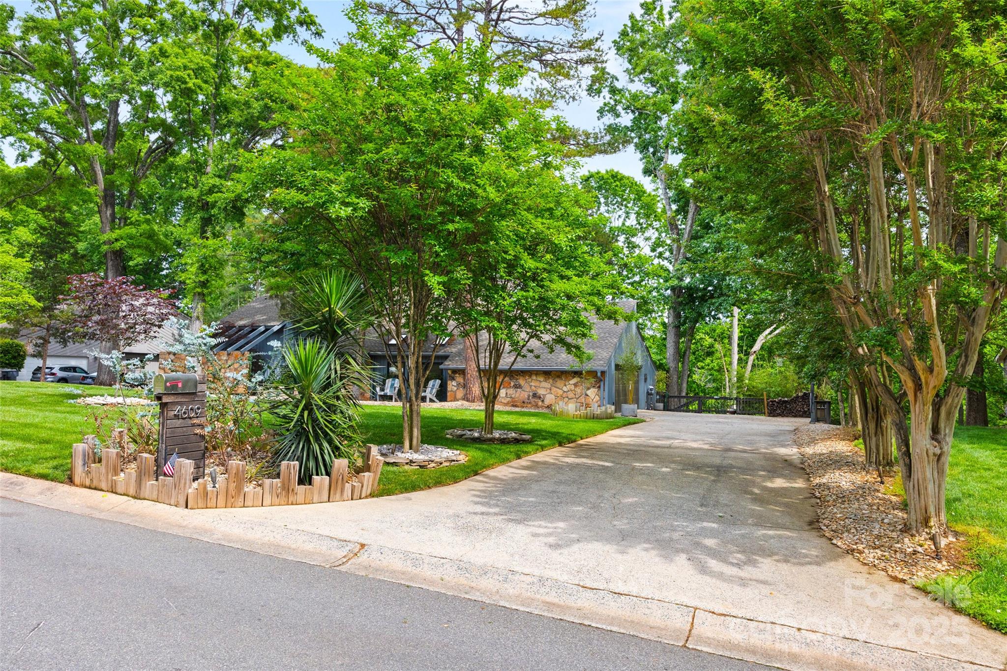 4609 Rounding Run Road Charlotte, NC 28277 - Photo 3 of 48 a view of a street with a house in background
