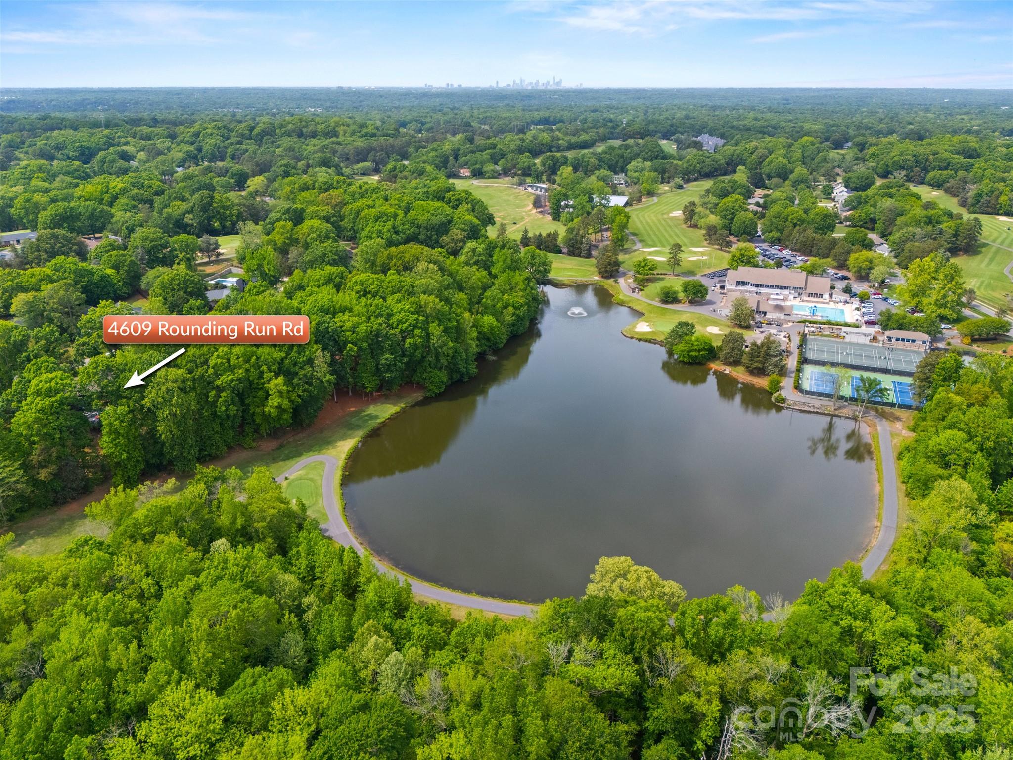 4609 Rounding Run Road Charlotte, NC 28277 - Photo 45 of 48 a view of a lake with a city