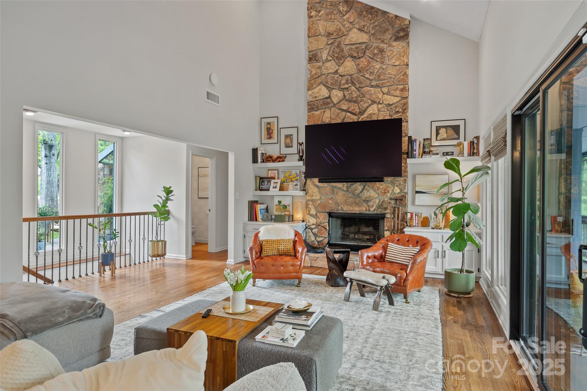 4609 Rounding Run Road Charlotte, NC 28277 - Photo 7 of 48 a living room with furniture a fireplace and a flat screen tv