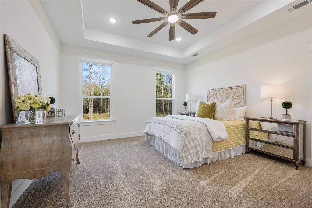 424 Private Road 5440 Point, TX 75472 - Photo 19 of 32 a bedroom with a bed and a chandelier