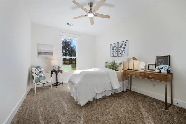 a bedroom with a bed and a desk