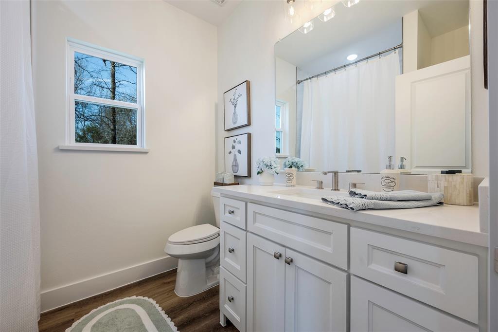 424 Private Road 5440 Point, TX 75472 - Photo 25 of 32 a bathroom with a toilet sink and mirror