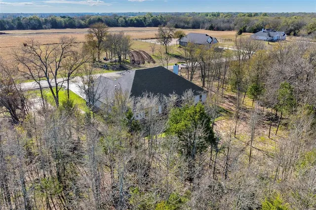 an aerial view of residential house with outdoor space and river