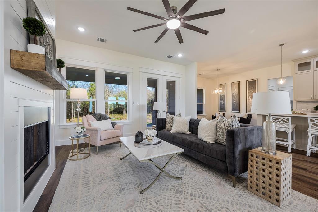 424 Private Road 5440 Point, TX 75472 - Photo 8 of 32 a living room with furniture a fireplace and a flat screen tv