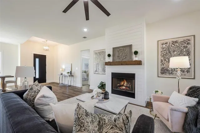 a living room with furniture and a fireplace