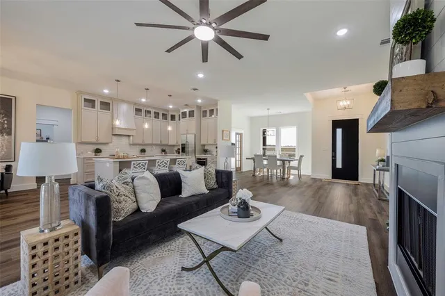 a living room with furniture and a fireplace