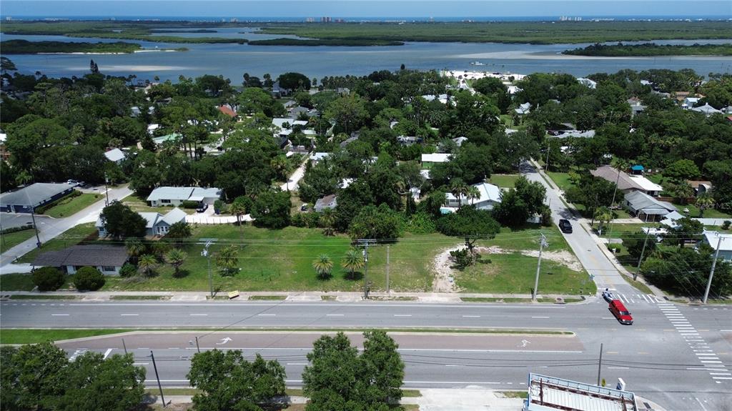 403 South Ridgewood Avenue Edgewater, FL 32132 - Photo 7 of 8 an aerial view of a city with lots of residential buildings ocean and mountain view in back