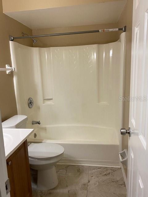 92 Windtree Lane, Unit 201 Winter Garden, FL 34787 - Photo 11 of 17 a bathroom with a sink a toilet and shower