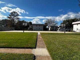 92 Windtree Lane, Unit 201 Winter Garden, FL 34787 - Photo 13 of 17 a view of a park with large trees
