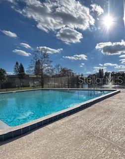 92 Windtree Lane, Unit 201 Winter Garden, FL 34787 - Photo 14 of 17 a view of a garden and lake