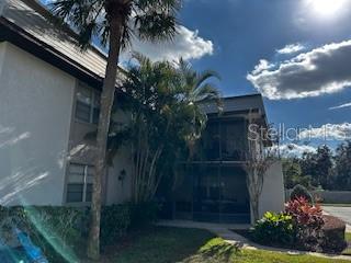 92 Windtree Lane, Unit 201 Winter Garden, FL 34787 - Photo 2 of 17 a view of a house with a yard