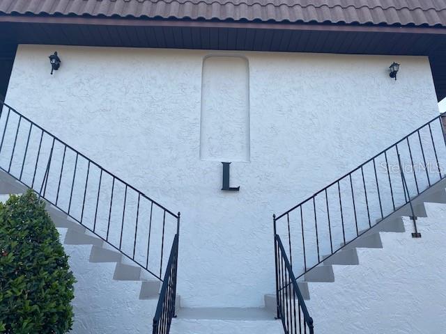 92 Windtree Lane, Unit 201 Winter Garden, FL 34787 - Photo 3 of 17 a view of entryway with wooden floor