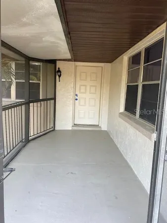 a view of empty room with windows